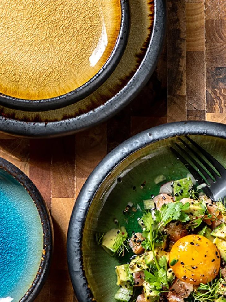Reactive-glaze bowls in blue and ochre