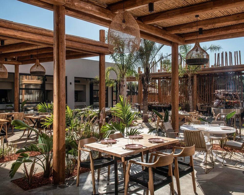 Hotel restaurant courtyard under timber pergolas